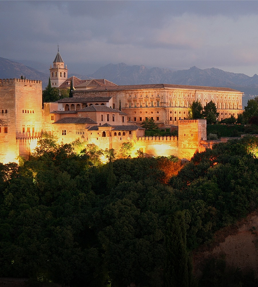 Sunset over tranquil lake and mountains.