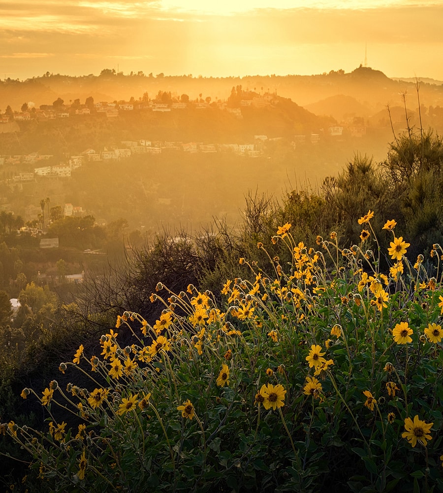 Sunset over tranquil lake and mountains.