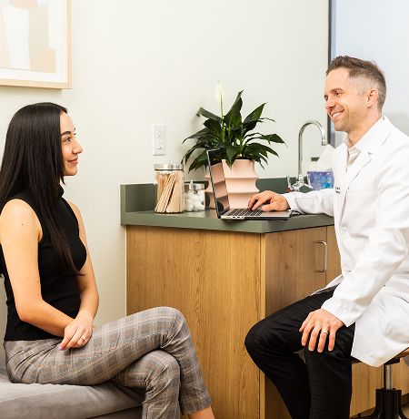 Doctor examining child with a stethoscope.