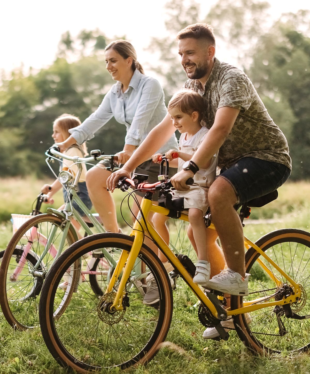 Woman in a floral dress among sunflowers.